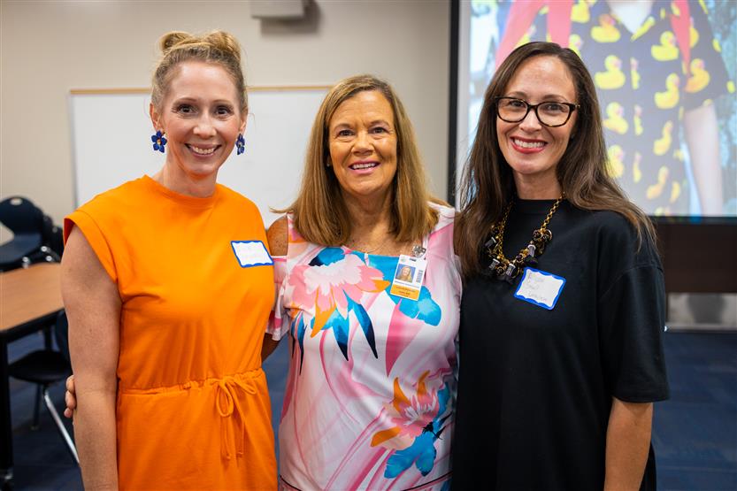 PTO members smile with a school principal